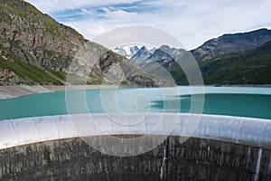 Spillway of Moiry Dam and turquoise water of Lac de Moiry, at the head of the Grimentz Valley, Switzerland