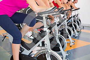 Spin class working out in a row