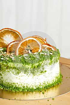 Spinach cake on table. Board with delicious tasty homemade cake on table. Wooden background