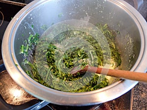 Spinach cooked in a span photo