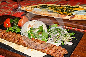 Spinach and egg pide, pita flat bread and puff hot lavash or lavas homebaked specialty