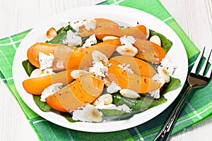 Spinach persimmon goat cheese salad with almonds