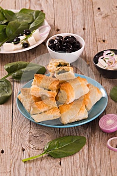 Spinach puffs with feta cheese.