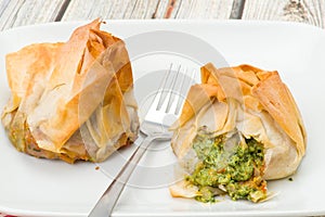 Spinach and ricotta filo pastry parcels photo