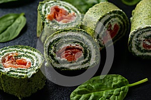 Spinach rolls with smoked salmon and cream cheese.