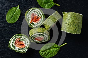 Spinach rolls with smoked salmon and cream cheese.