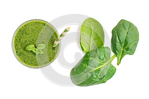 Spinach smoothies. Healthy green juice iwith spinach leaves solated on white background. Top view
