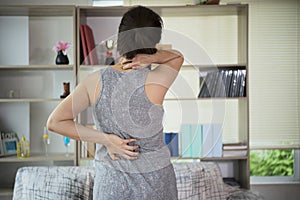 Spinal cord problems on woman`s back