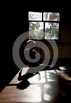 Spinal twist yoga pose in the studio, woman doing yoga asana ardha matsyendrasana