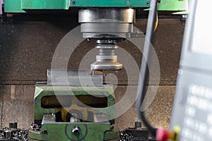 Spindle with a milling cutter in a mandrel on a CNC milling machine photo