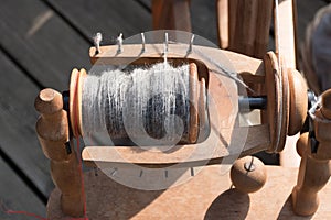 Spindle and wool, detail of a traditional spinning wheel