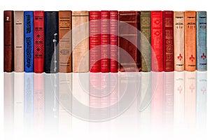 Spines of old books on a white background