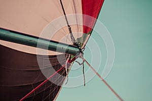 Spinnaker with uphaul, blue sky in background