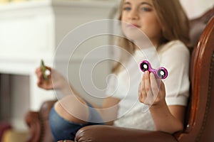 Spinner concept. cute little girl showing spinners