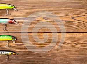 Spinner for fishing on a wooden background. Fishing equipment, copy space