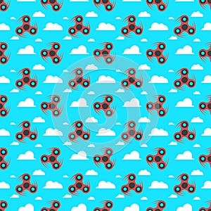 Spinner. A pattern of red spinners in a flat style. Spinners are spinning against the sky. Flat, white clouds. A modern antistress