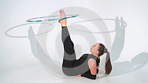 Spinning acrobat beautiful hula hoops in slow motion