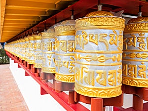 Spinning Buddhist prayer drums or prayer wheels at a monastery