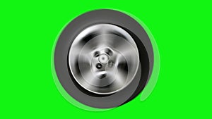 Spinning car wheel on green screen.