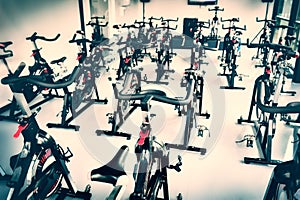 Spinning class with empty bikes photo