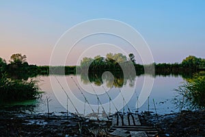 Spinning with a coil for evening fishing on the lake or river.