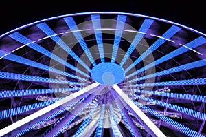 Spinning ferris wheel at night light
