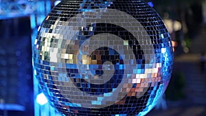 Spinning glitterball on dancefloor