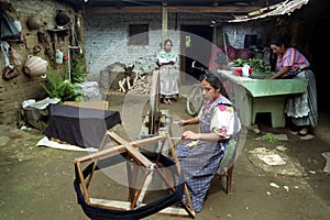 Spinning Guatemalan Indian woman working at home