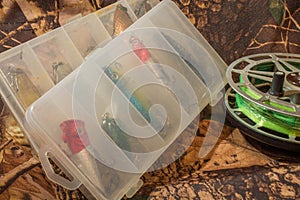 spinning lures in the box and fishing reel