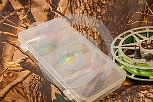 spinning lures in the box and fishing reel