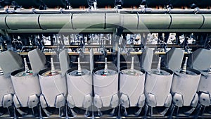 Spinning spools in the textile factory unit