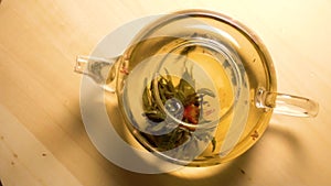 Spinning teapot with green tea inside