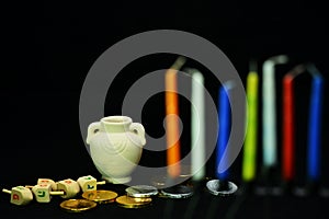 Spinning top, oil pot, golden coins and candles are symbols of J