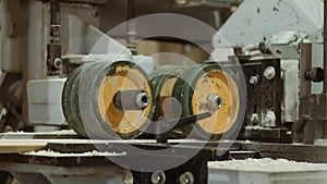 Spinning wheels of board edger machine at sawmill production