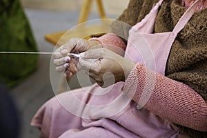 Spinning with a wooden spinning wheel