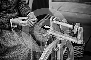 Spinning with a wooden spinning wheel