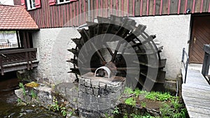 Spinning wooden water wheel in a German village