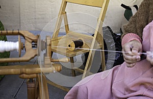 Spinning wool on spinning wheel