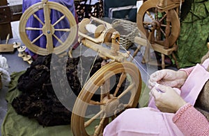Spinning wool on spinning wheel