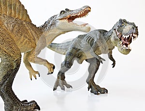 A Spinosaurus Faces Off with A Tyrannosaurus Rex photo