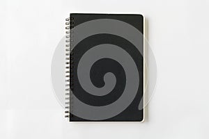 Spiral black notebook on white background