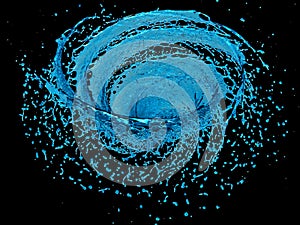 Spiral blue water splash isolated on a black background photo