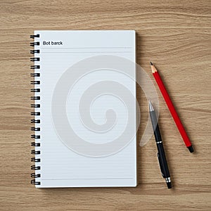 A spiral-bound notebook with lined pages lies open on a light wood surface. The top