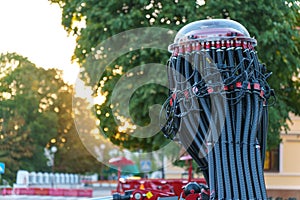 Spiral cable connecting truck cabin and trailer. Pneumatic hoses and electric cables on the coupler of the hitch between a tractor