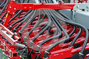 Spiral cable connecting truck cabin and trailer. Pneumatic hoses and electric cables on the coupler of the hitch between a tractor