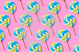 Spiral candy colorful lollipop on colored background, birthday, birthday