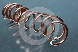 Spiral of copper wire on metal surface
