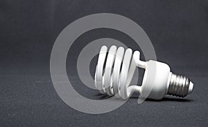 Spiral fluorescent lamp isolated on black background