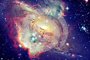 Spiral galaxy and stars in deep space. Elements of this image furnished by NASA