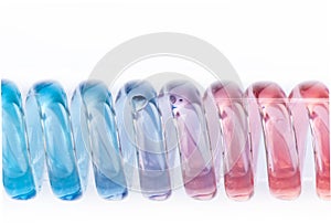 Spiral glass tube with red and blue liquid.